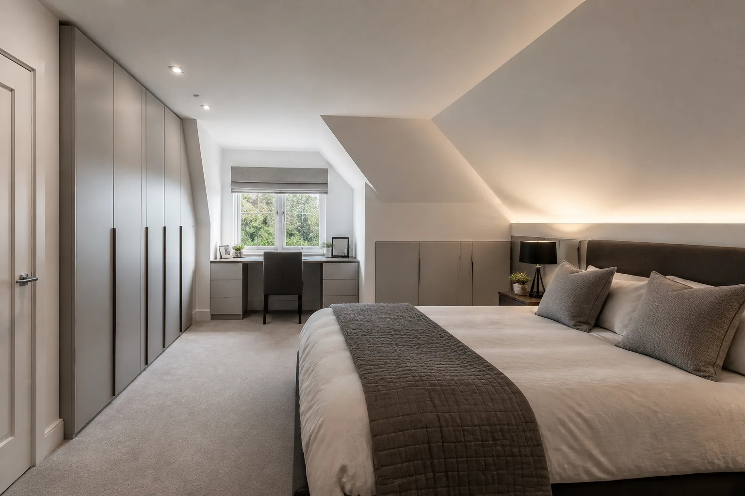 A sloped-ceiling main bedroom, designed for it