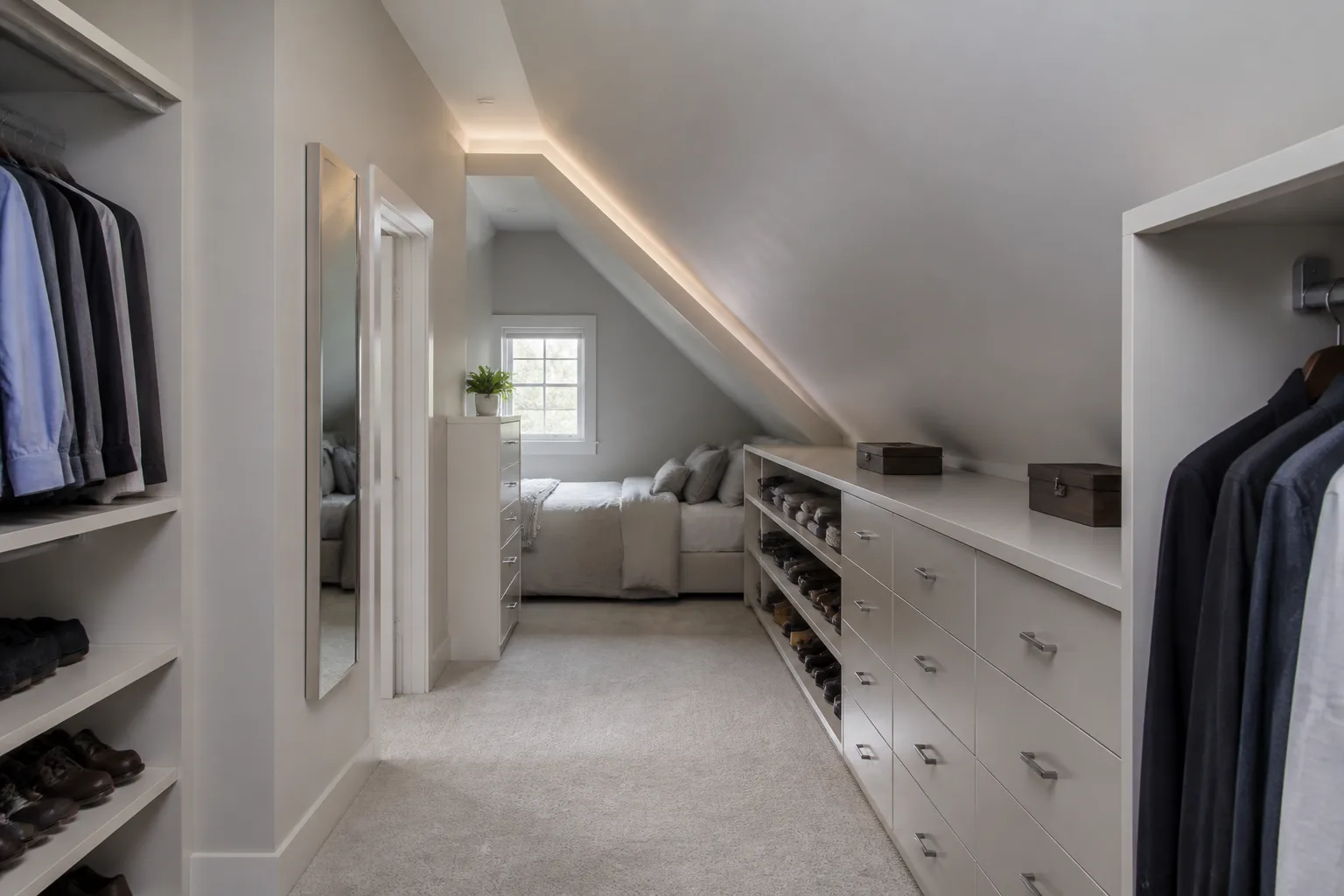 A sloped-ceiling walk-in closet, designed for it